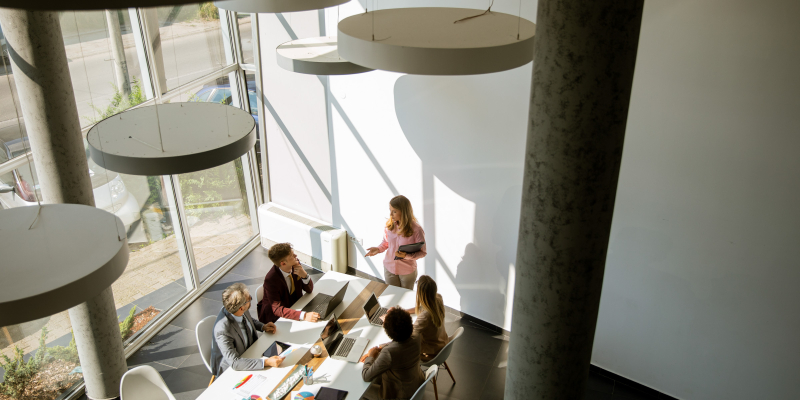 Overhead view at group of multiethnic business people working together in the office