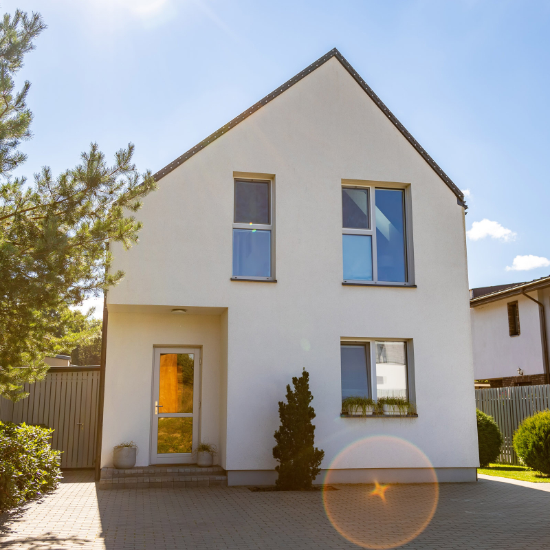 Outside view of a simple private contemporary house on a sunny day